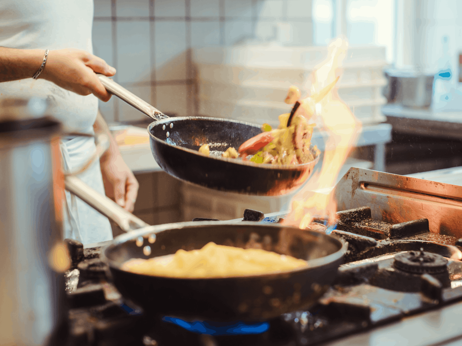 Chef cooking in a professional restaurant kitchen